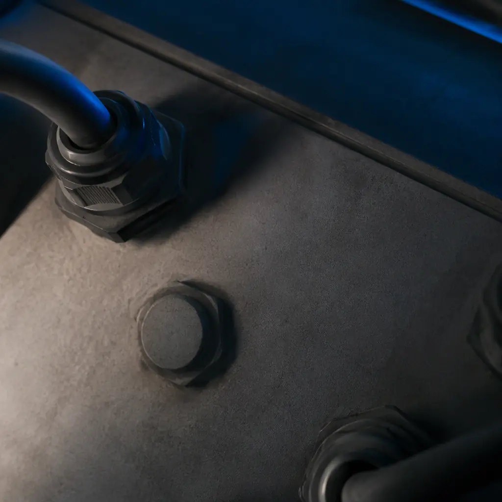 Industrial print production detail with machined metal surface and blue accent light